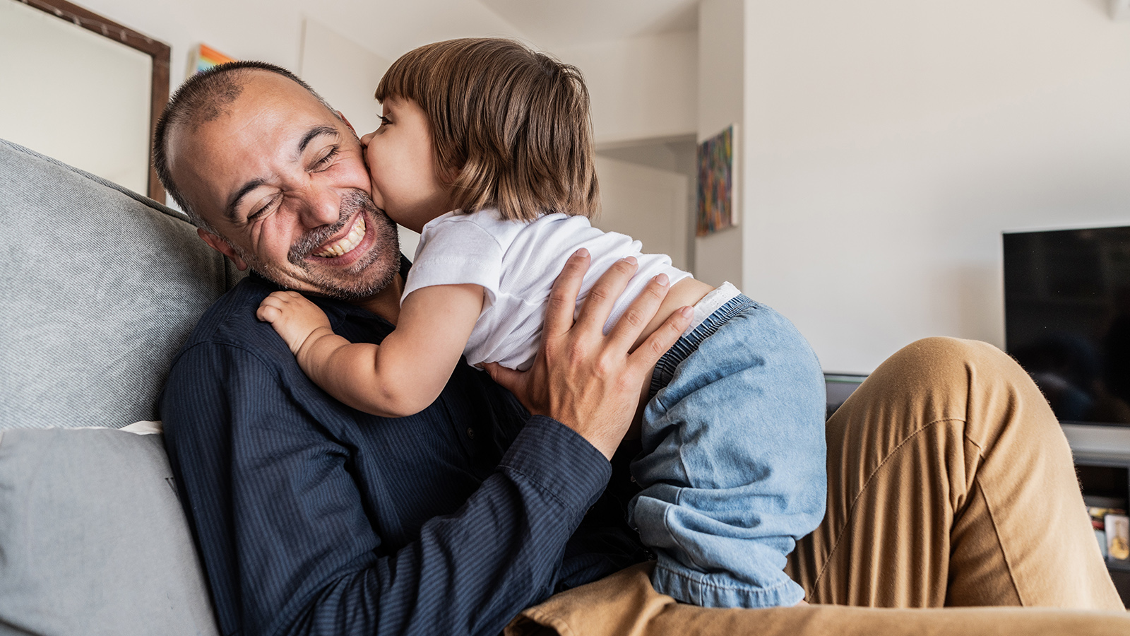Man and granddaughter playing and laughing
