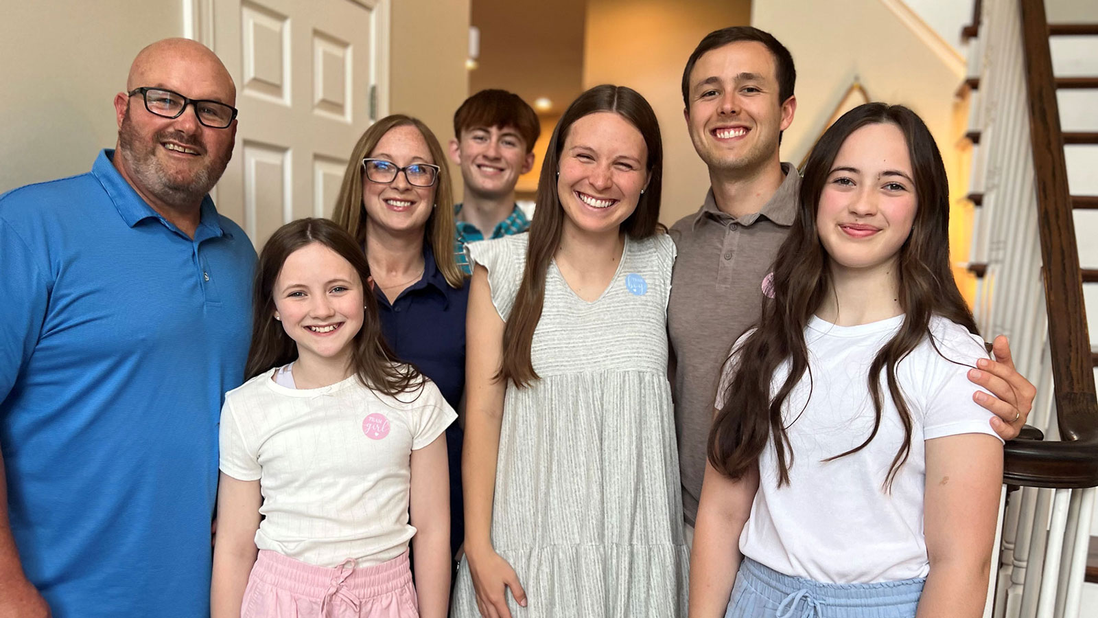 Virtua patient Jill poses in her foyer with her husband, sons and daughters