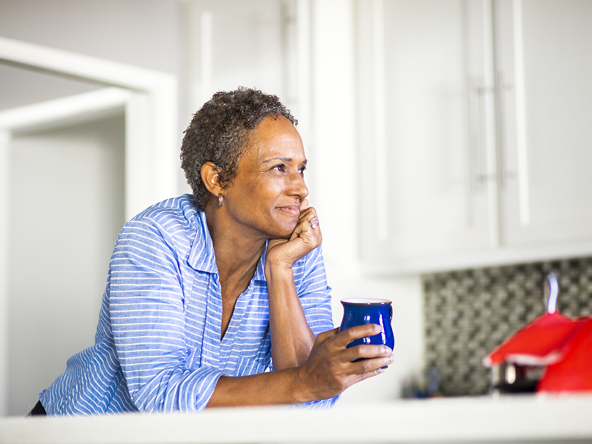 African American woman enjoying a cup of coffee